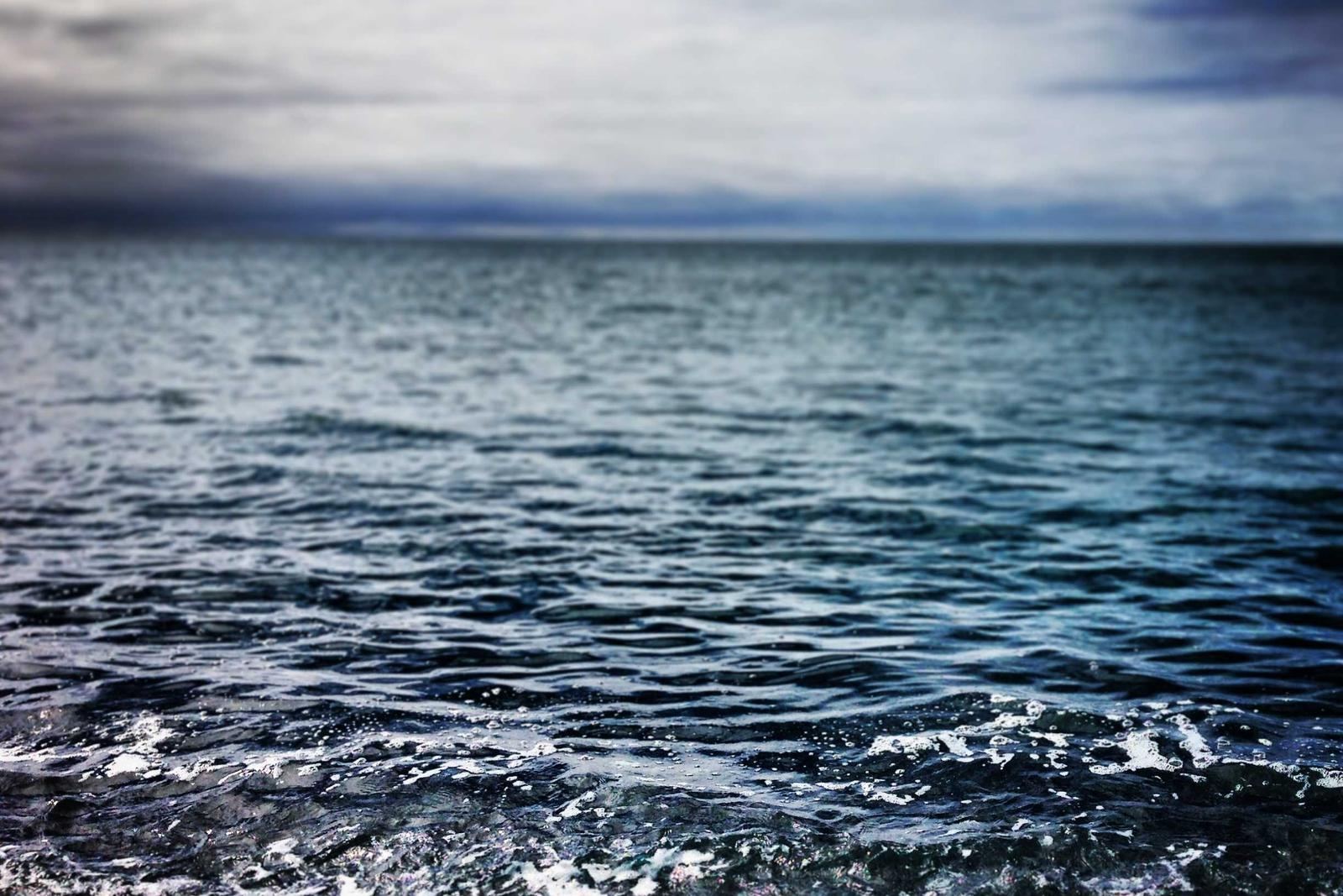A dark sea under heavy clouds