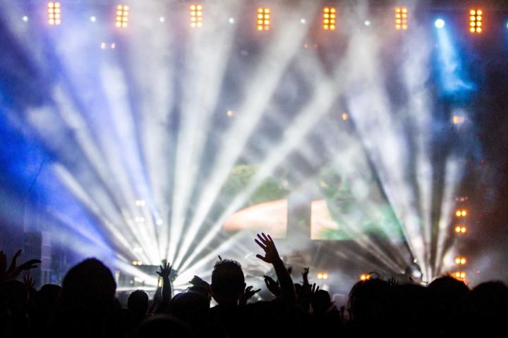 Stage lights over a crowd at a concert