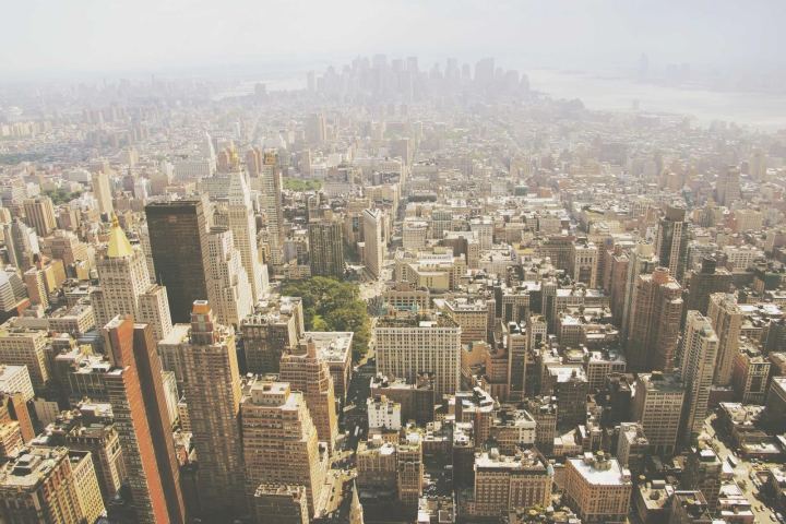 An aerial view of a dense city in the haze